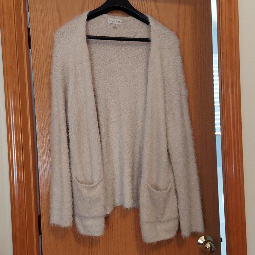 Sweater with convertible collar.